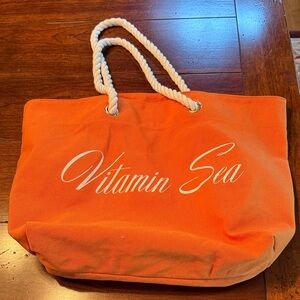 Vitamin Sea Orange Canvas Beach Bag with Rope Handles and Script Logo
